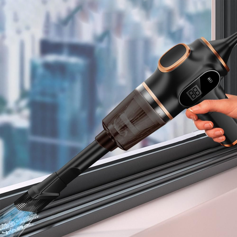 MiniVacuum Handstaubsauger in Schwarz reinigt eine Fensterlaufschiene